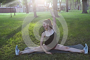 Stretching woman in outdoor exercise smiling happy doing stretch