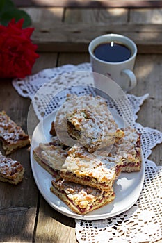 Streusel pie stuffed with rose jam, served with coffee. Rustic style
