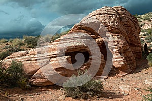 Striated rock formation under a stormy sky in Red Rock Canyon Conservation Area, Nevada, USA