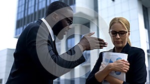 Strict boss scolding subordinate for bad work results after important meeting