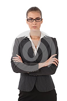 Strict businesswoman with arms folded