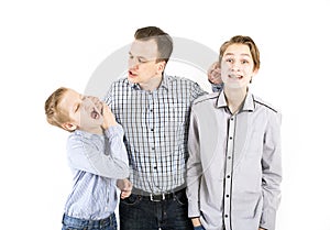 Strict father punishes his sons.