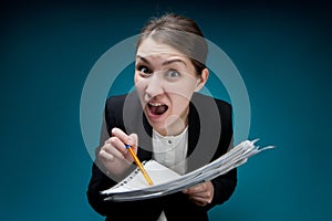 Strict female boss screaming, poking a pen into documents