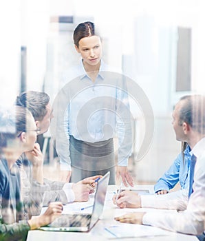 Strict female boss talking to business team