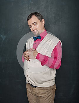 Strict funny teacher vintage style looking at you on blackboard