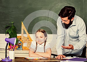 Strict pedagogue. Doing hometask paperwork. Tired kid unmotivated study learn. Private lesson. Homeschooling with father photo