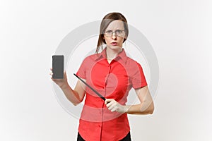 Strict severe serious teacher woman user in red shirt hold mobile smart phone with blank empty screen to copy space