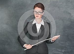 Strict teacher with wooden stick