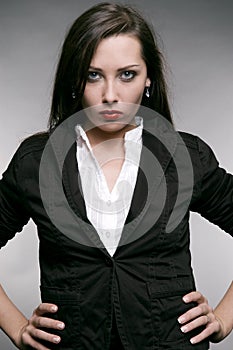 Strict woman in black jacket