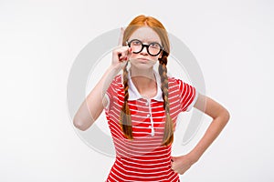 Strict young woman with two braids pointing up