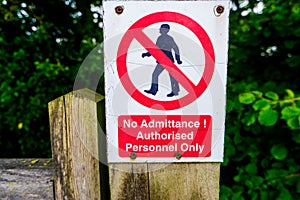 Strictly no admittance to unauthorised persons on wooden gate post photo