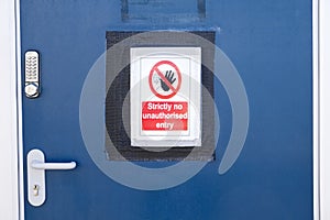 Strictly no unauthorised access sign at construction site security door