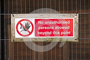 Strictly no unauthorised access sign at construction site security door