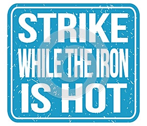 STRIKE WHILE THE IRON IS HOT, words on blue stamp sign