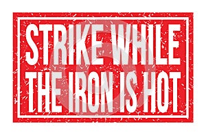 STRIKE WHILE THE IRON IS HOT, words on red rectangle stamp sign