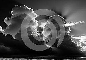 Dramatic Black and White Clouds with Sun Rays