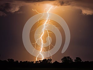 Striking Photograph of a Bright Yellow Lightning Bolt in a Dramatic Night Sky