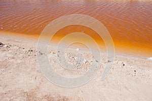 Striking red pool used in the production of salt near Rio Lagartos, Mexico, Yucatan photo