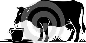 Silhouette of a cow drinking water from a bucket depicting rural farm scene suitable for logo design or illustrations photo