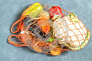 String bag with fresh organic vegetables from the farm