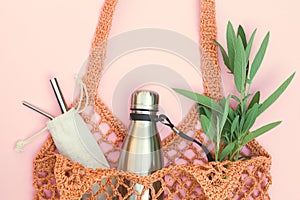 String bag with reusable water bottle and metal straws, go green and use no single use plastic photo