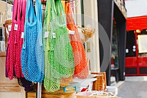 String bags. Store with many different colors string bags, basket. No plastic, zero waste concept store. Recyclable reuse shopping