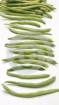 String bean raw food isolate on wood white sort spacing