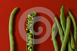 String beans seeds closeup on isolated red background