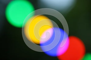 String of blurred multicolored holiday lights
