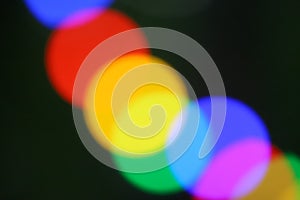 String of blurred multicolored holiday lights