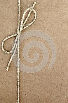 String Bow on Brown Paper