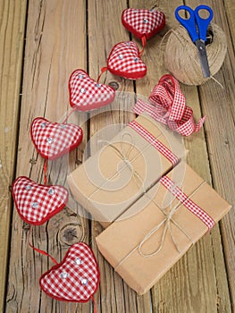 String and brown paper parcels with scissors, string, ribbon an