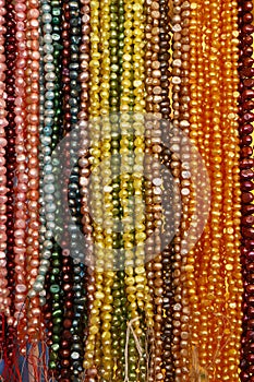 String of colorful bead necklace on retail display