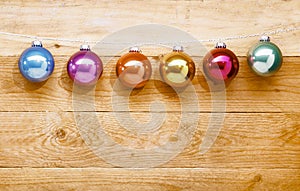 String of colourful Christmas baubles