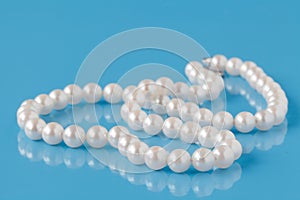 String of Pearls on a blue background