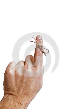 String tied on finger as reminder