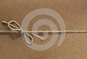 String tied on Recycled Paper