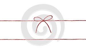 String twine rope red color with bow isolated on white.Thread,fiber