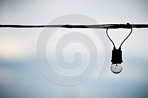 String wired of bulb on blue sky background