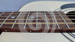 Strings accoustic guitar with wooden body and neck