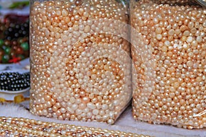Strings and bags of pearls at the market in Gulangyu Island in C