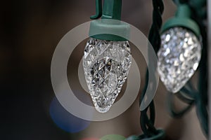 Strings of christmas lights hanging down ready to decorate a home