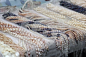 Strings of deluxe cultive freshwater pearls for celebrations photo