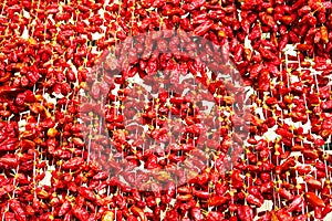 Strings of dried red peppers.