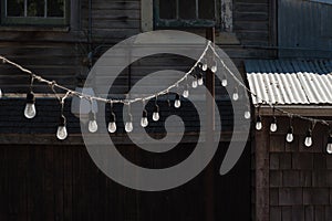 Strings of lights behind a barn