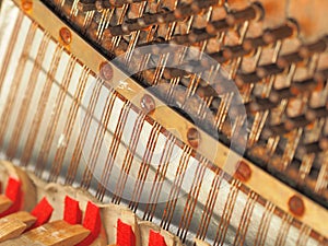 Strings and mechanics of a desolate old weathered piano