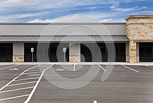 Strip Mall - Blank Signs and Parking Lot photo