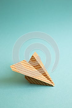 Stripe pattern kraft paper plane on green background