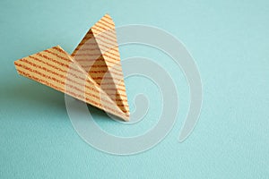 Stripe pattern kraft paper plane on green background