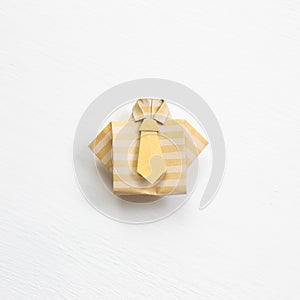 Stripe pattern paper shirt origami on white background